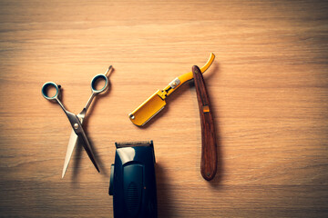 Close up of accessories for barber shop. Scissors, razor, trimmer.