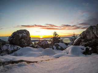 ZAVIZAN - 26.09.2020. Early snow in the Northern Velebit National park in Croatia. Beautiful sunset and view of the Adriatic sea