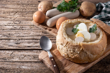 Zurek. Traditional Polish soup on wooden table	