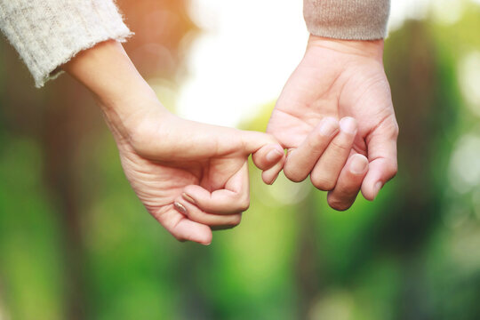 Woman and man holding hands, Happy couple love in the outdoor. concept lover valentine day.