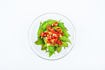 A plate of delicious cold edamame on white background