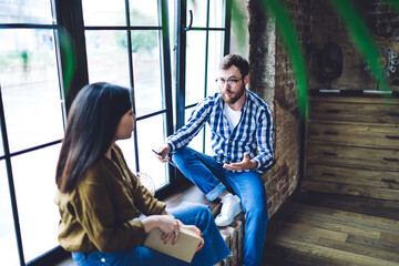 Diverse colleagues discussing business plan together