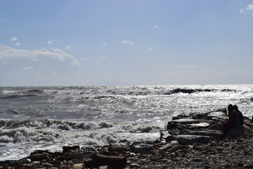 Sea waves and stones at the seaside during a windy summer day - Picture taken in Marina di Cecina,...