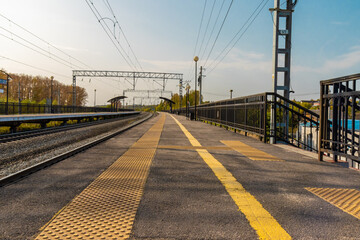 Fototapeta na wymiar Empty open street train station at sunday morning