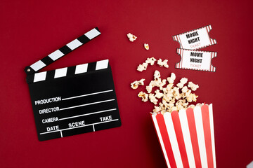 Movie clapperboard and cinema tickets. Home movie night, party invitation