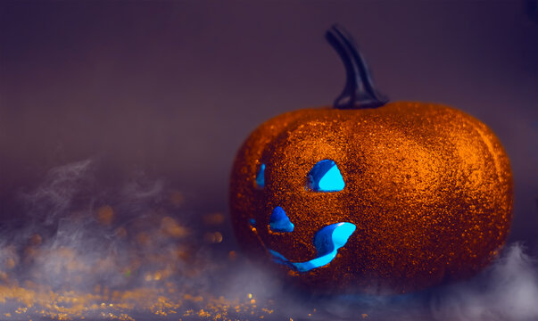 Halloween. Pumpkin Head With Red Eyes On A Dark Background. Jack Lantern. Smoke. Copy Space. Selective Focus