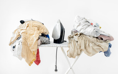 iron on ironing board against white wall background. High quality photoiron on ironing board against white wall background. dirty laundry before ironing after washing