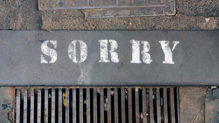 word sorry at the street