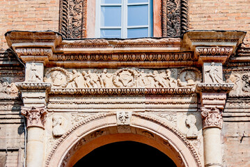 Obraz premium Close up of the bas-relief above the entrance of Palazzo Mozzanica, known also as Palazzo Varesi, built in the 15th century, in Lodi, Lombardy region, northern Italy.