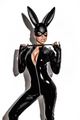 Foto op Plexiglas Halloween sexy girl in bunny costume. Sexy blonde beautiful woman posing in latex costume and black bunny mask on white background. Hallooween concept. © marcink3333