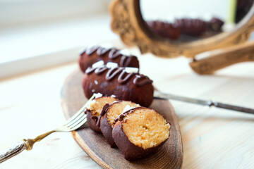 Traditional Russian biscuit cake potato - kartoshka - cake and cream rolled into small potato shape cakes, and then dipped in chocolate coating