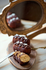 Traditional Russian biscuit cake potato - kartoshka - cake and cream rolled into small potato shape cakes, and then dipped in chocolate coating