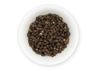 Black pepper, herbs, spices in a white bowl in top view.