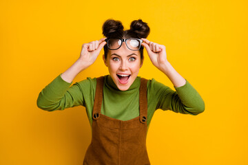 Photo of astonished crazy girl touch specs impressed incredible academic news wear trendy sweater isolated over shine color background