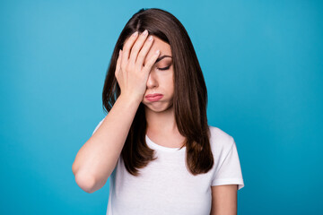 Photo of frustrated girl touch hand face suffer corona virus high temperature inflammation wear white t-shirt isolated over blue color background