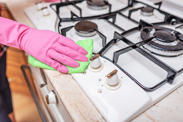 Cleaning the oven in the kitchen.