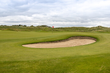 golf course with hole and bunker