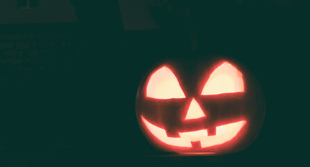 The halloween pumpkin shining in the dark