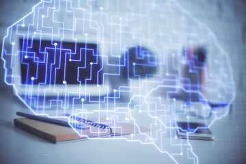 Multi exposure of work space with computer and human brain hologram. Brainstorm concept.