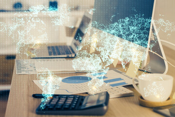 Computer on desktop with social network hologram. Multi exposure. Concept of international people connections.