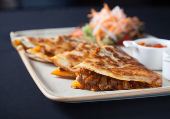 Quesadilla wish salad and sauces front view