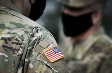 US soldiers wearing protective face masks. Quarantine in army.