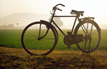 Fototapeta na wymiar Classic farmer's cycle in the field