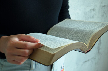 Christian reading and study the bible at home or Sunday school at church with window light And some...