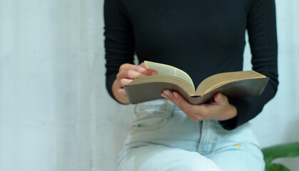 Christian reading and study the bible at home or Sunday school at church with window light And some...