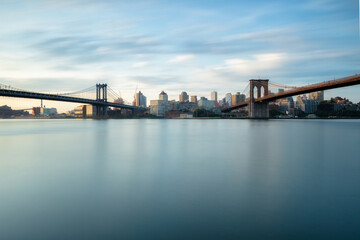 Dumbo from east river with long exposure at sunrise 