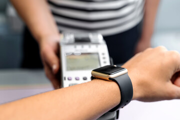 Top view of contactless payment with smart watch. Technology of paypass.