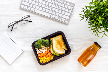 Call for delivery concept. Lunch boxes with meal on working place
