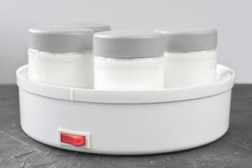 home yoghurt making machine, dairy product fermentation at home. greek plain simple yogurt with no sugar added. fermented food with lactobacullus and kefir. 