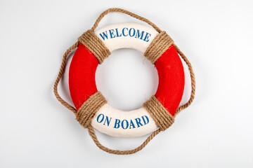 WELCOME ON BOARD. Lifebuoy with text on white background