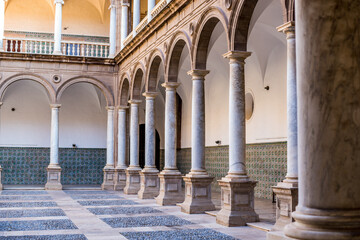 background of columns with arches. cloister of the cathedral of st john the baptist