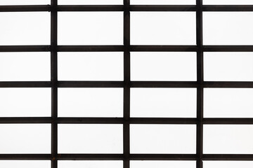 bottom view of empty ceiling semi translucent glass roof with steel grille