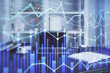 Stock market graph and table with computer background. Multi exposure. Concept of financial analysis.
