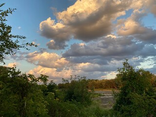clouds over the river at sunset