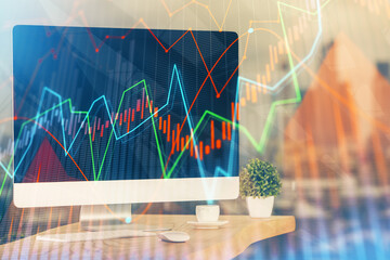 Financial market graph hologram and personal computer on background. Double exposure. Concept of forex.