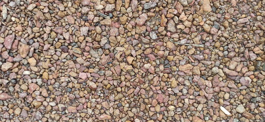 The surface of the stone or the surface of the gravel