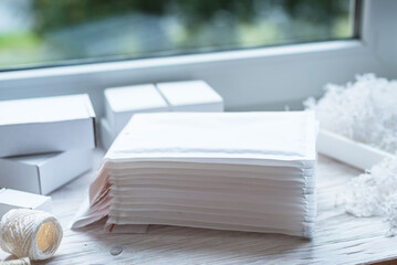 Set of white paper bubble envelopes for postal shipping