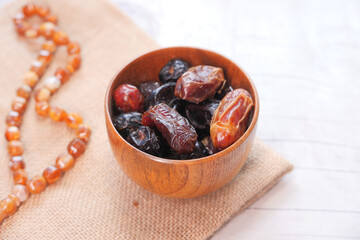 the concept of ramadan, fresh date fruits in a bowl 