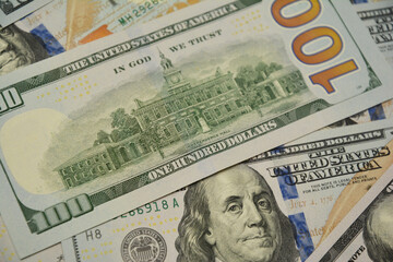 A close-up on One Hundred Dollar Banknotes, bills, American Dollars Cash Money as a concept of...