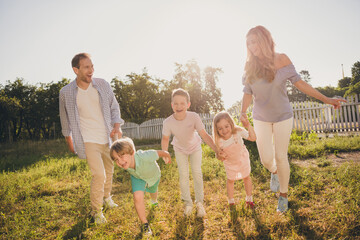 Full body size photo of big family five people harmony good mood relax spend vacation parents play open air games small kids generation comfort fenced home green garden outside outdoors