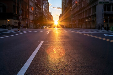 Sunset shines over the New York City streets during the coronavirus lockdown in Midtown Manhattan, ...