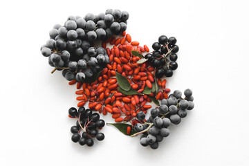 Bunch of currants, grapes and barberries on white background. Isolated.