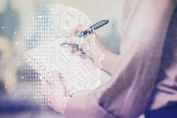 Multi exposure of woman's writing hand on background with brain hologram. Concept of brainstorming.
