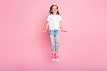 Full length photo of pretty adorable charming girl kid jump enjoy weekend rest wear good look...