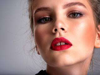 Beautiful photoshpped brown-hair girl. Close up of a pretty caucasian girl with red lipstick.