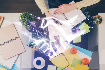 Handshake drawing over hands taking notes background. Concept of success. Double exposure